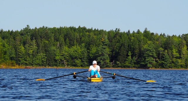 Grace rowing on NS lake.