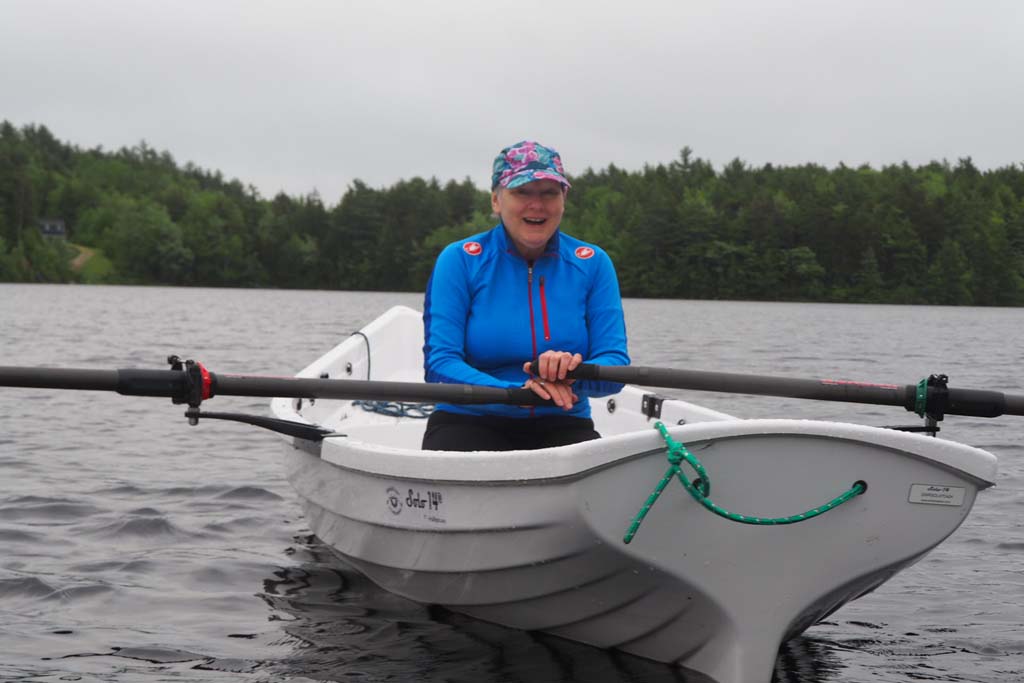 Grace rowing on NS lake.